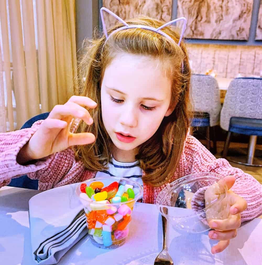 child at table with sweets at spotlight restaurant motorpoint arena