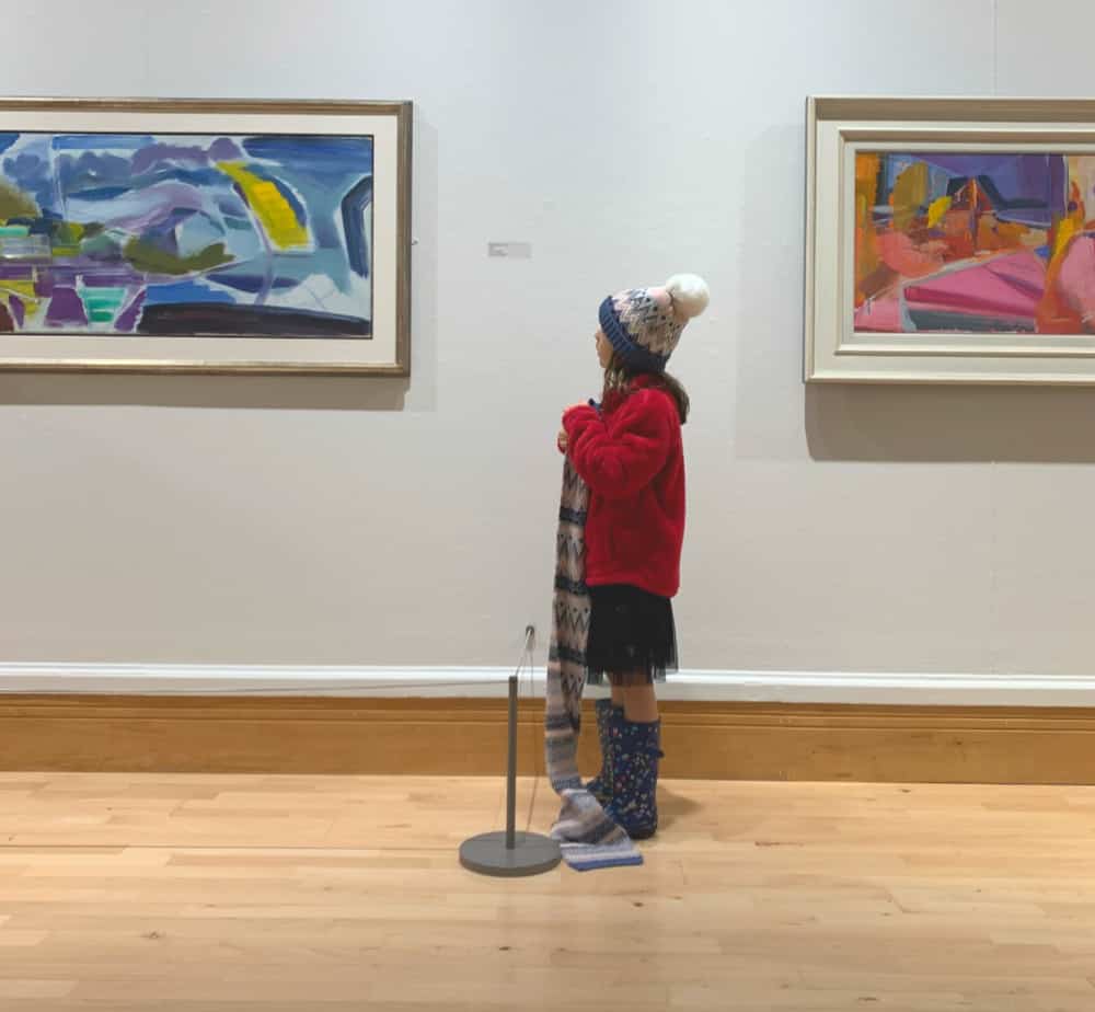 child looking at art