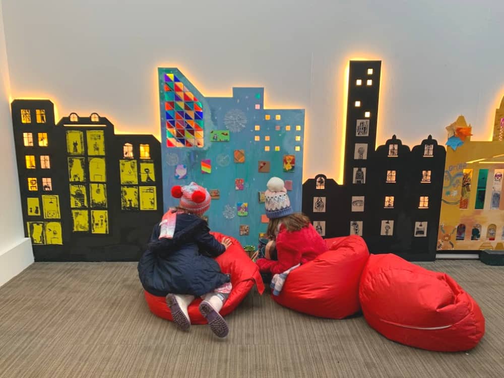 children looking at artwork for the snow dragon