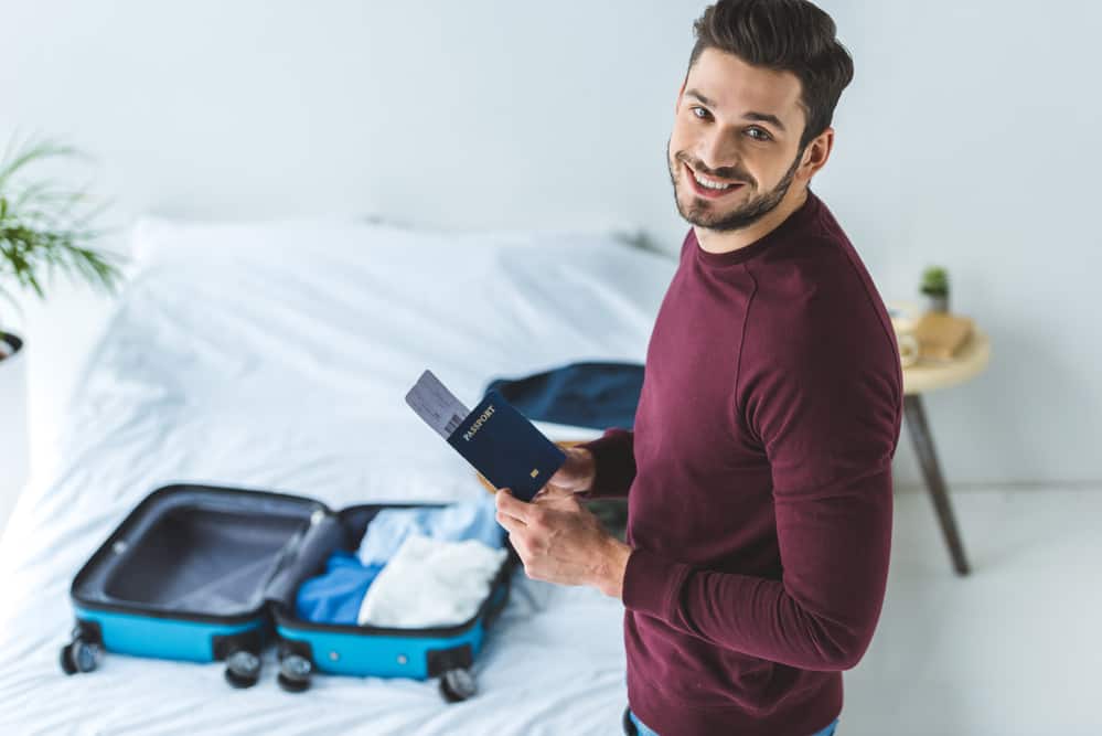 man holding passport 