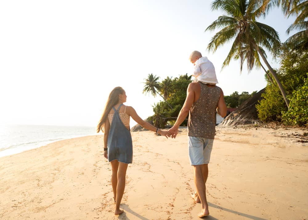 family walking on beach 