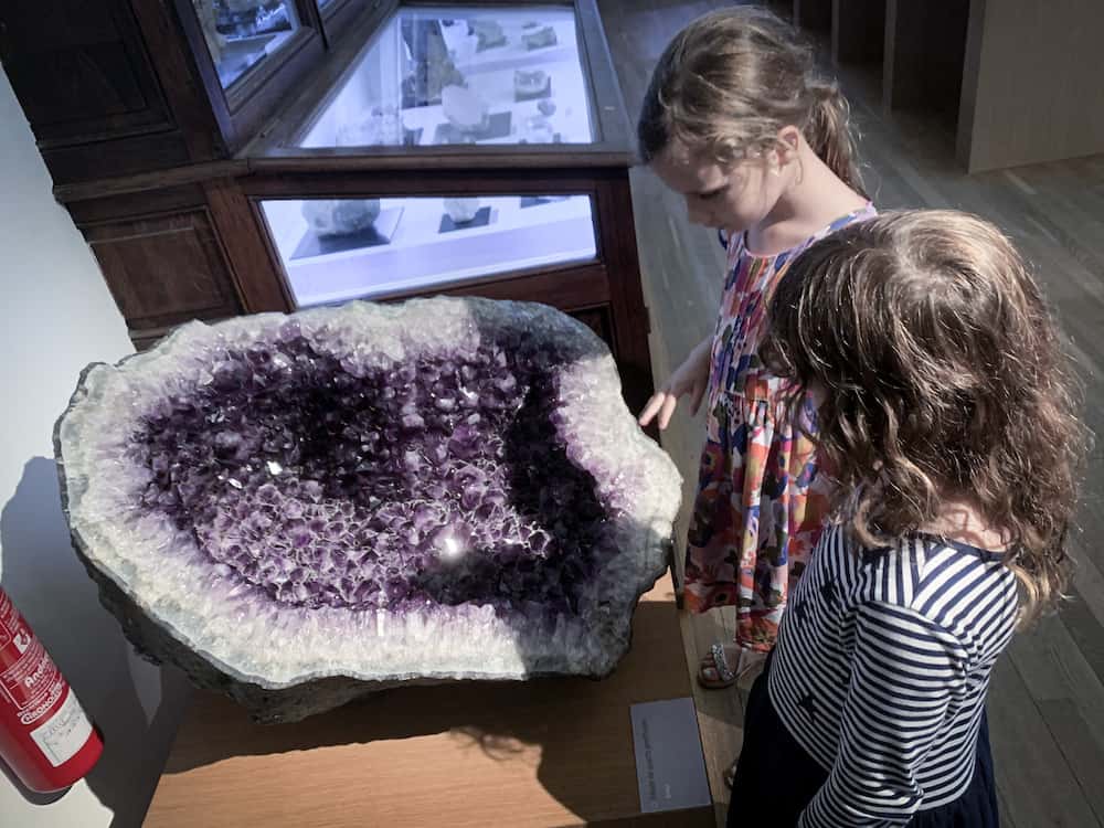 children looking at geode 