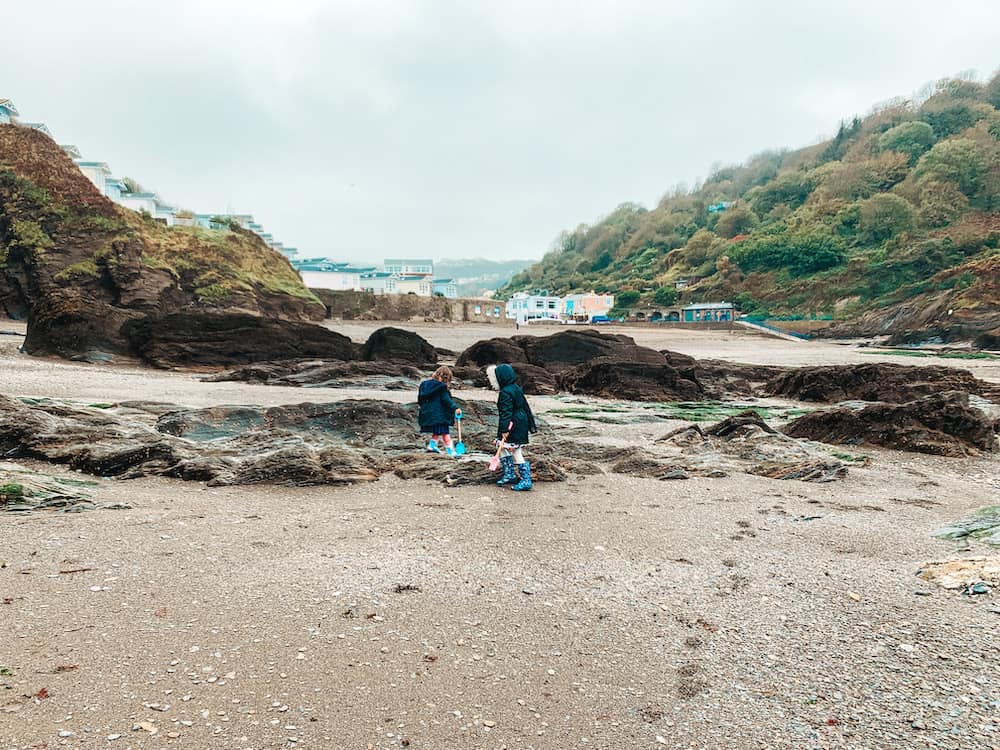 children playing on hele beach in north devon 