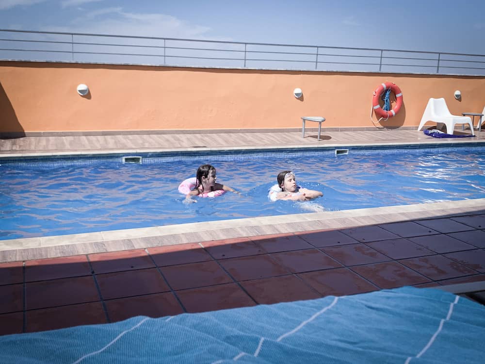 kids in roof top pool at novotel seville 