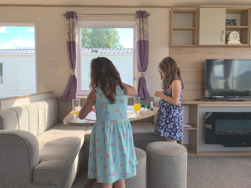 children playing inside caravan