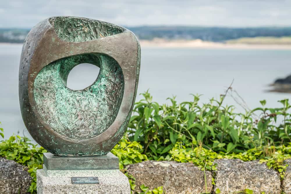 St. Ives, England - June 2018 : Epidauros II - Barbara Hepworth sculpture in a garden above the beach and bay, Cornwall, UK