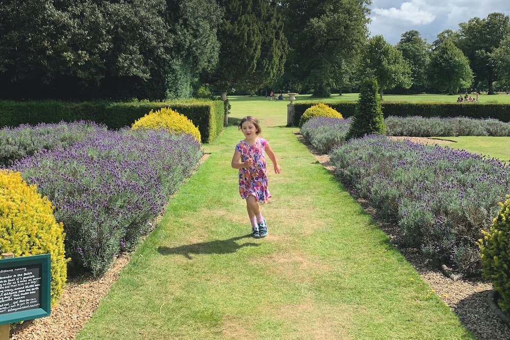 child running in garden 