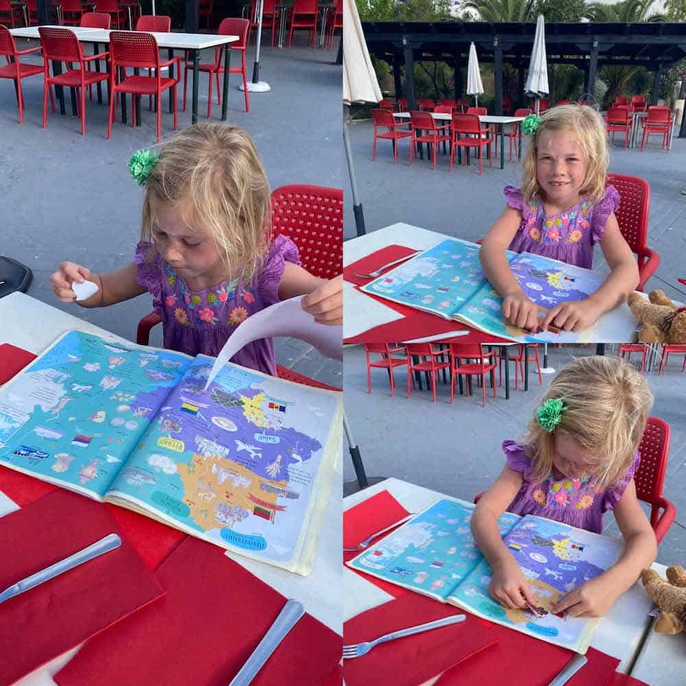 children looking at books at dinner 