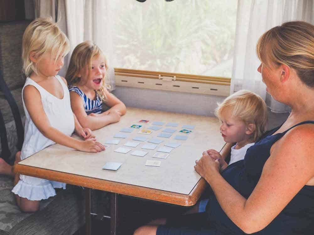 family playing a game inside van 