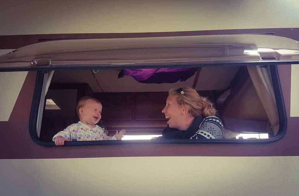 mum and baby inside hymer van 