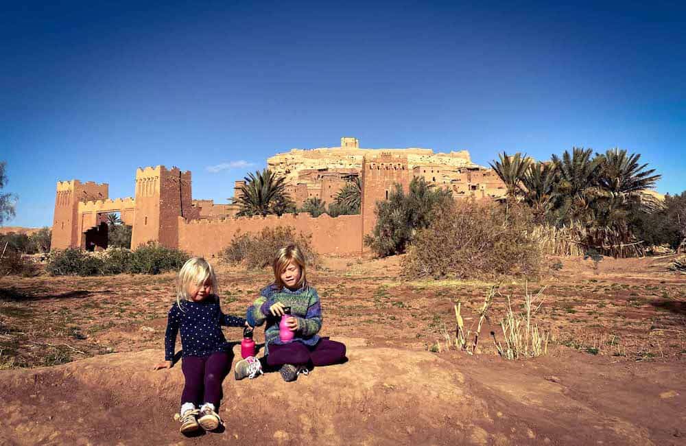 children in front of Moroccan castle 