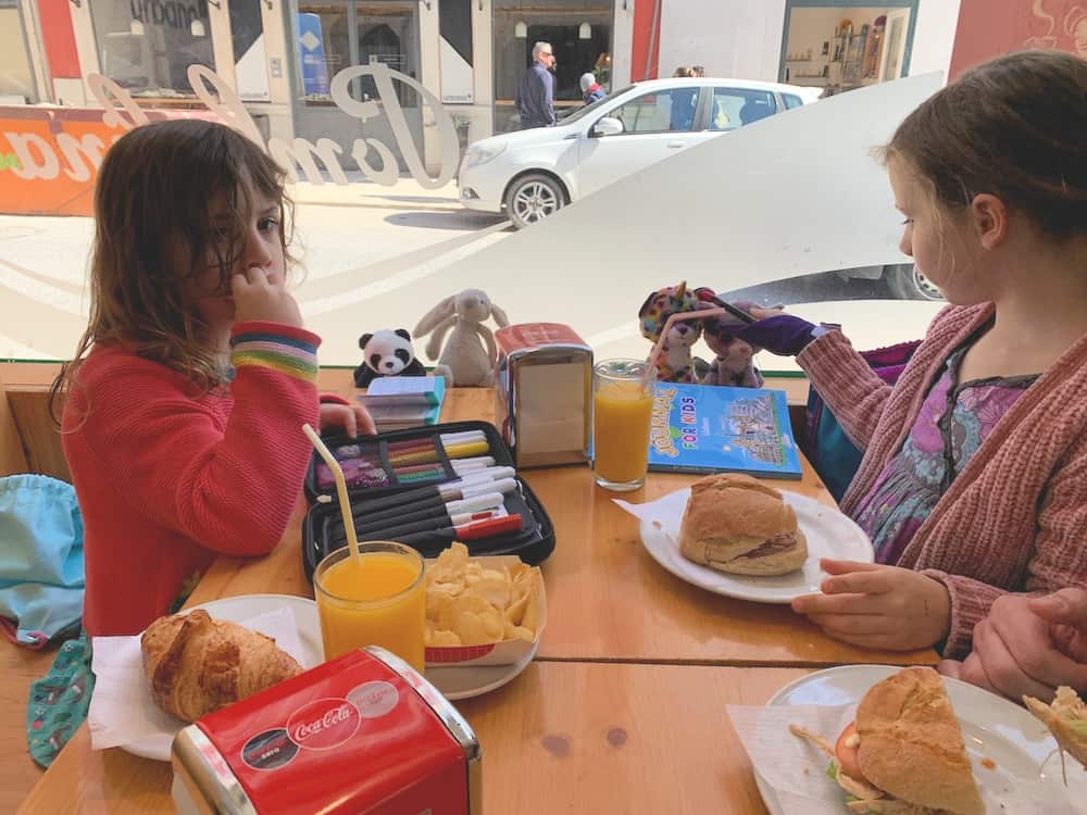 children eating in lisbon cafe