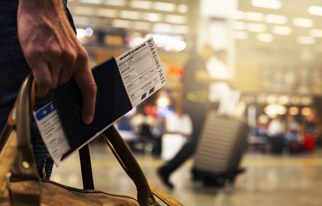 passenger holding ticket and passport