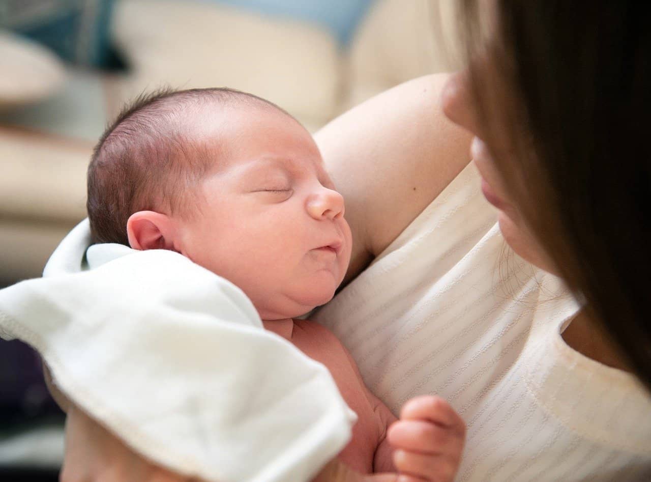 mum holding baby