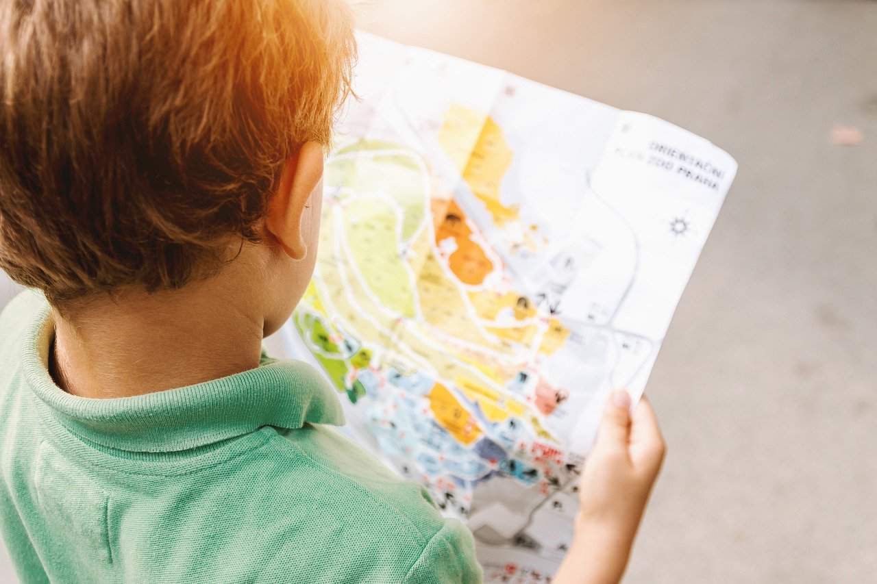 boy reading map