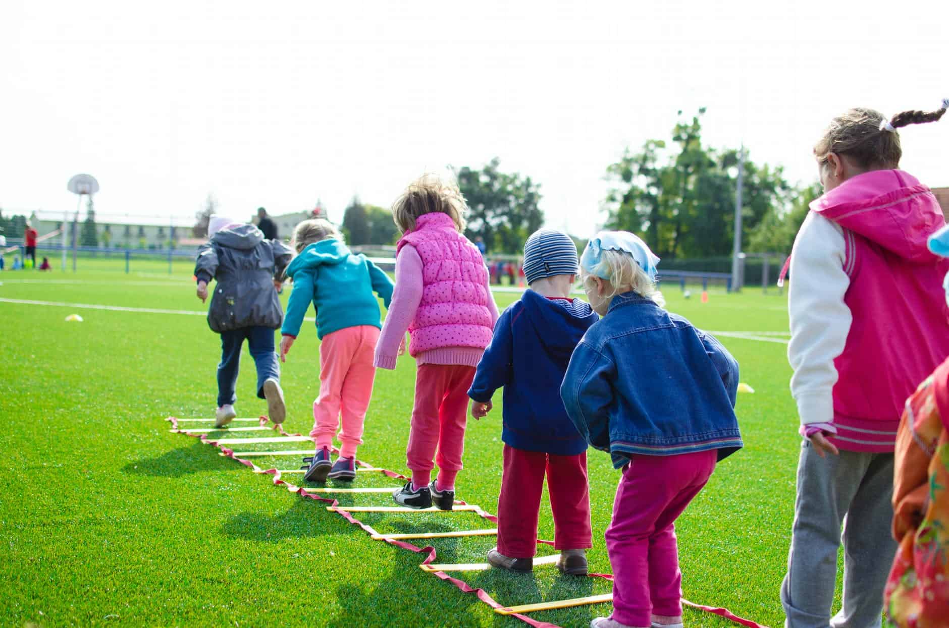 pexels-photo-296301 children s team building on green grassland