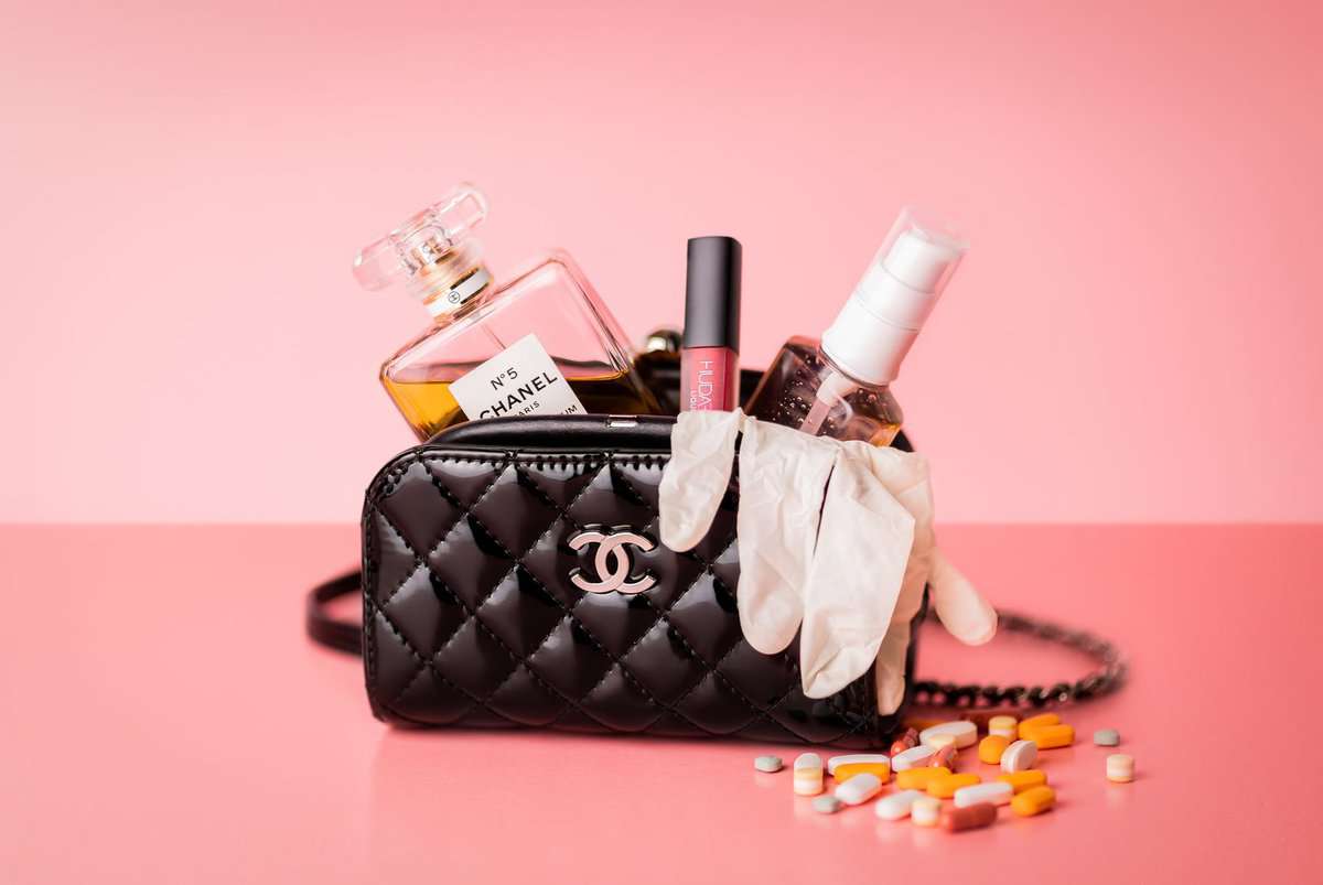 pexels-photo-6062560 black chanel bag on a pink surface