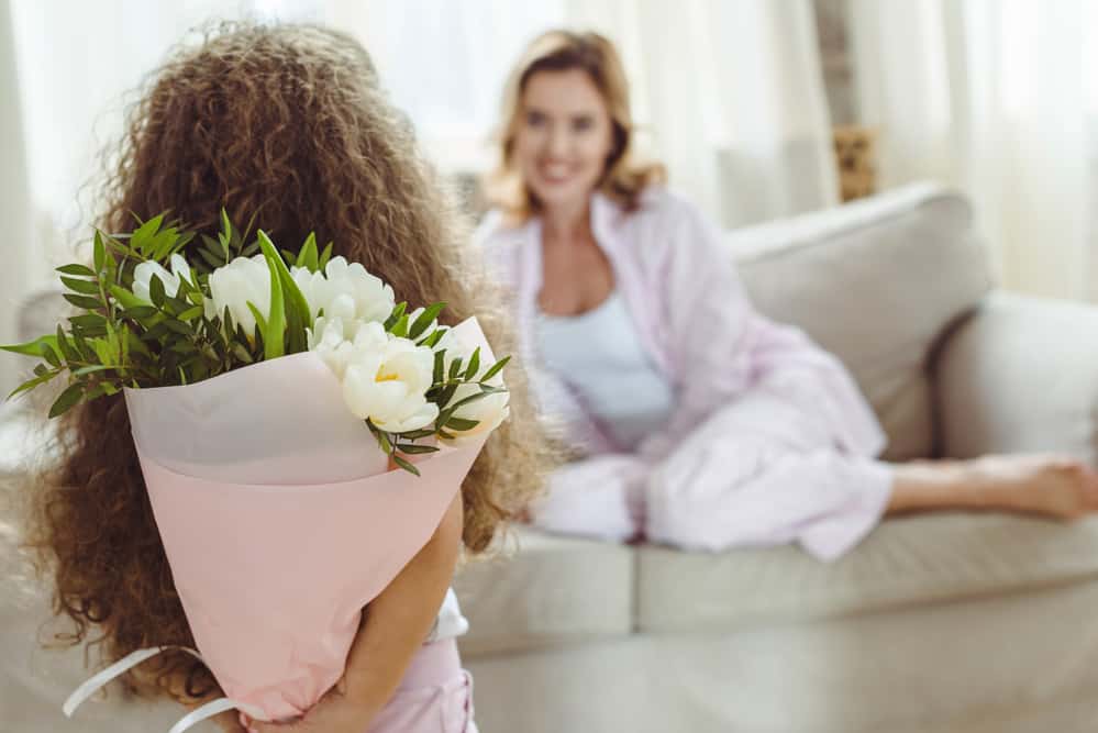girl with flowers for Mum