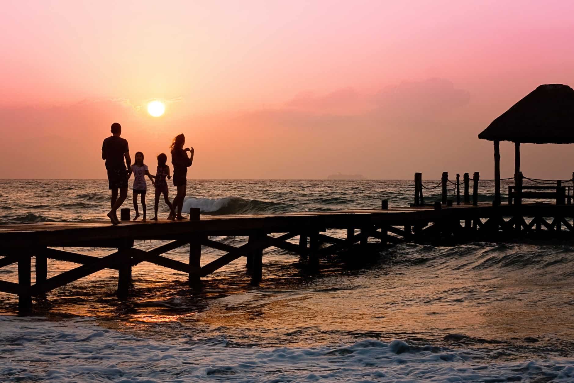 family-pier-man-woman-39691 man beach holiday woman