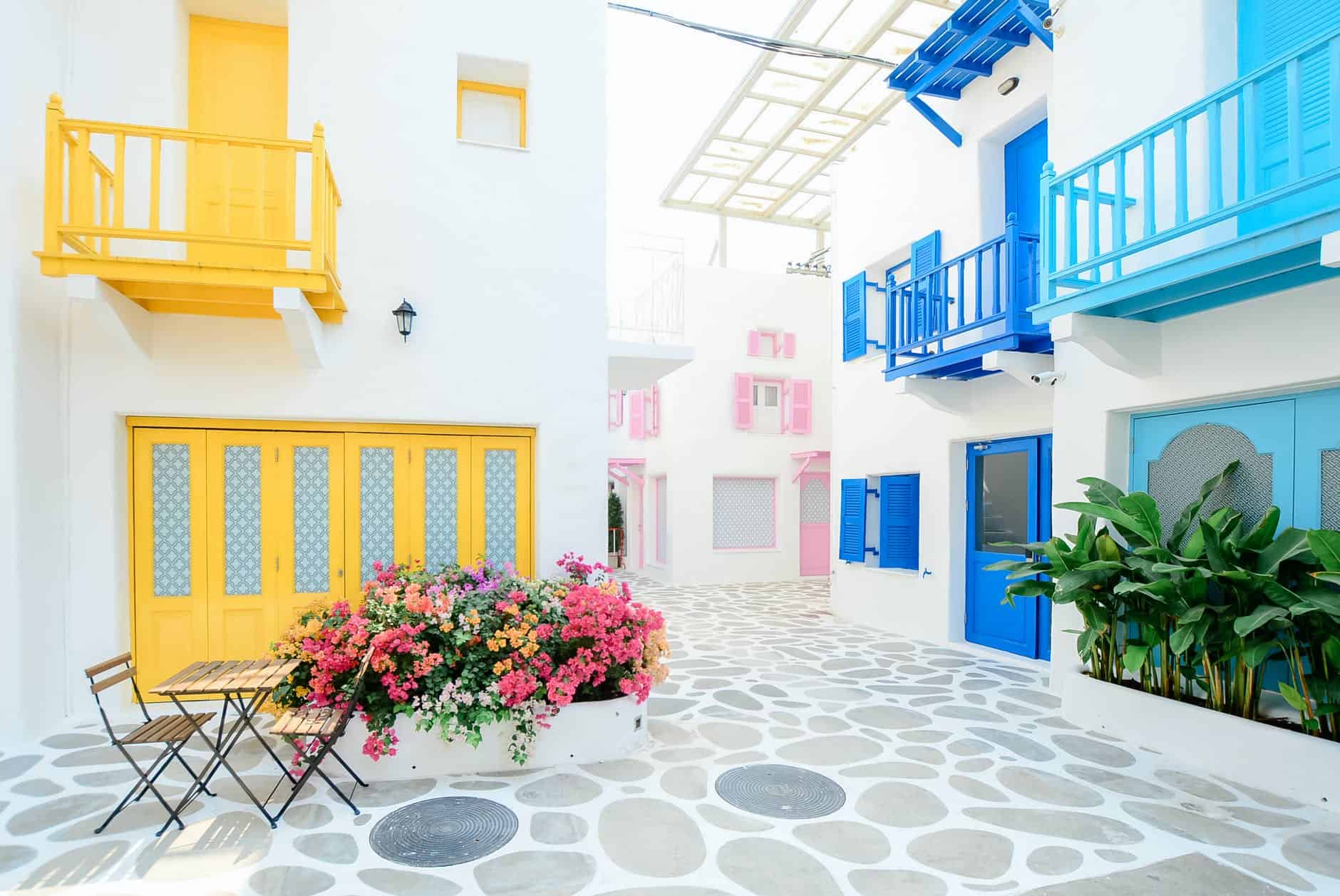 pexels-photo-347141 architectural photography of three pink blue and yellow buildings