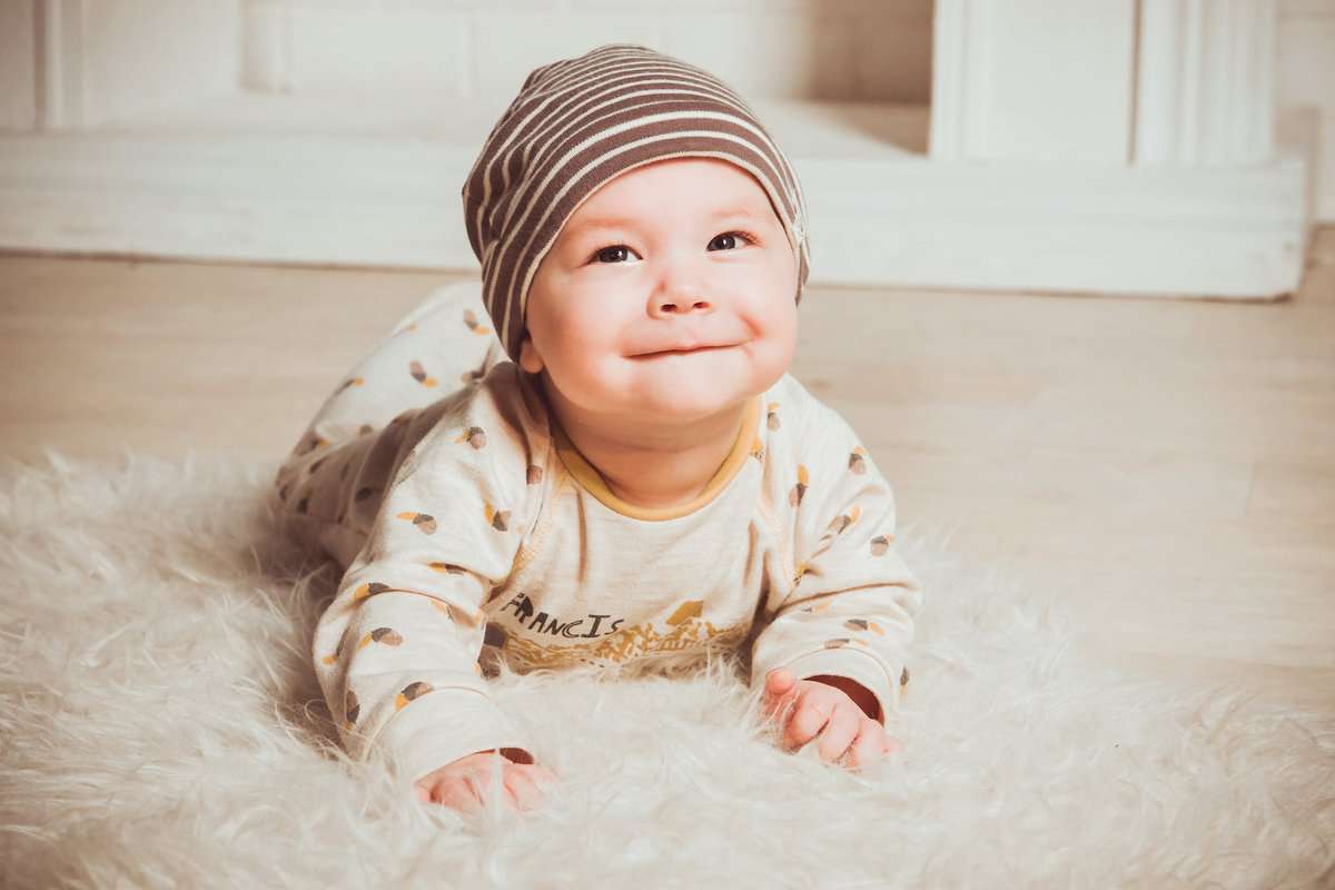 pexels-photo-1648375 baby on fur rug