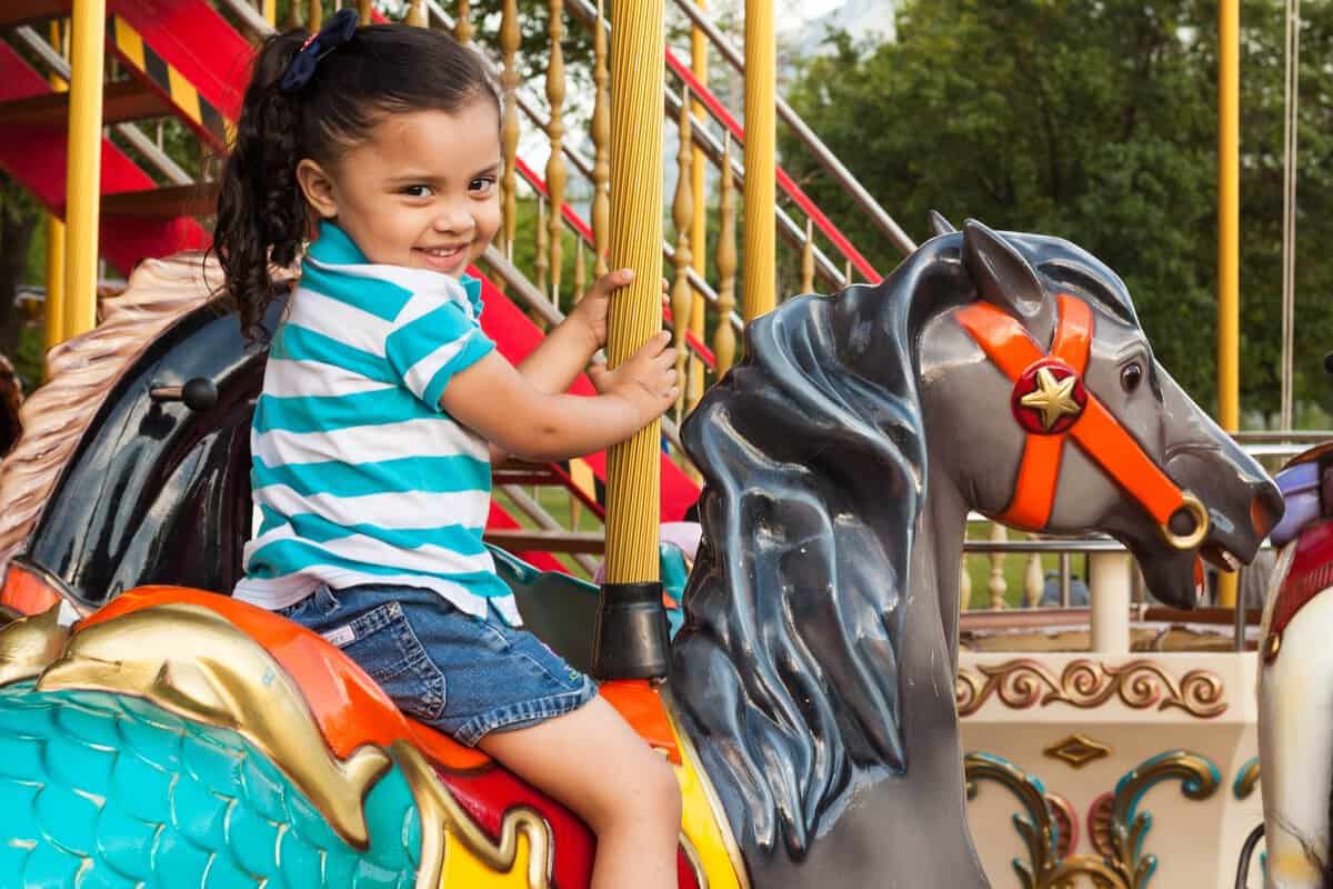 pexels-photo-2181192 girl riding carousel