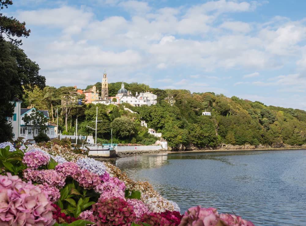 View on the town of Portmeirion from the beach at the estuary of the river Dwyryd which leads into Tremadog Bay in North Wales