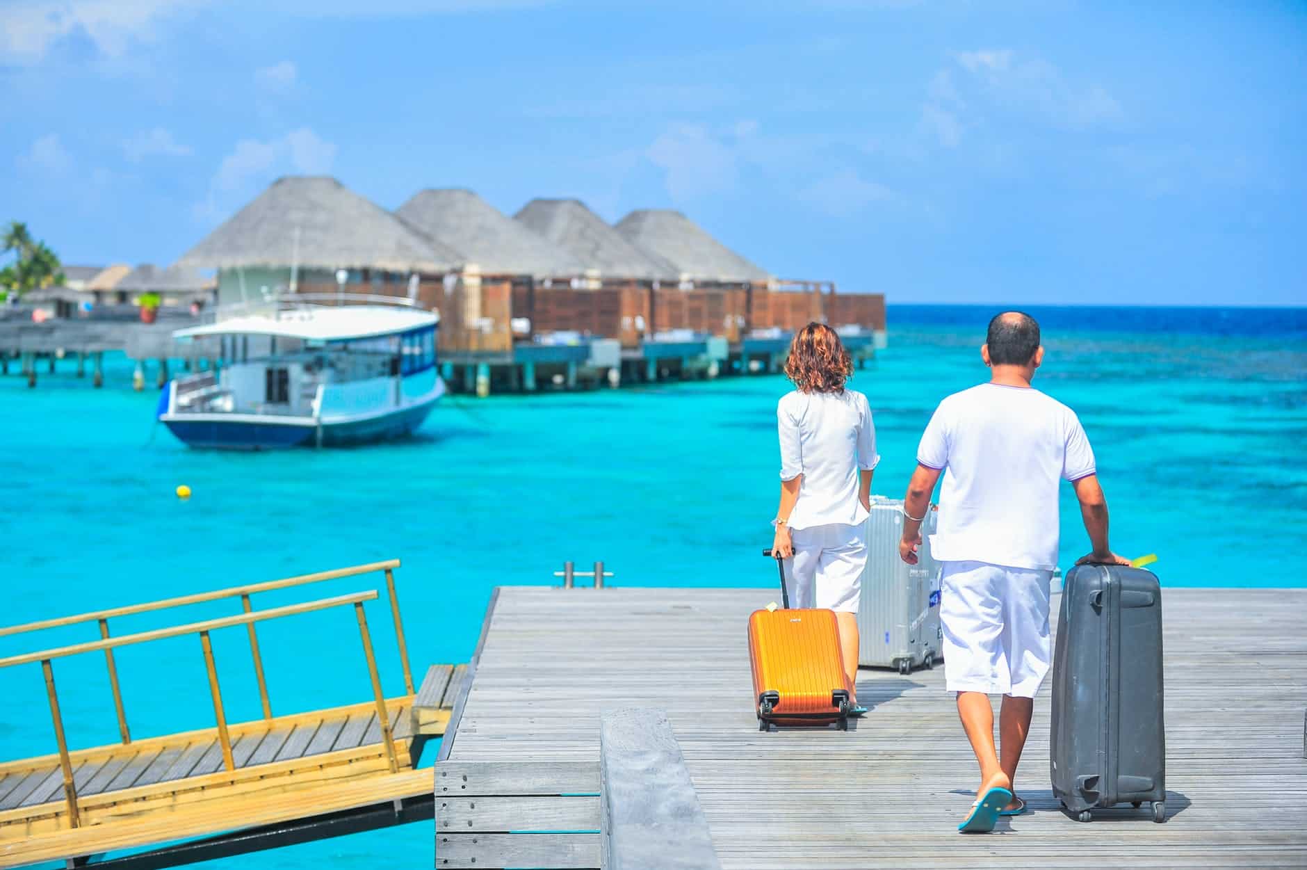 pexels-photo-1268855 man and woman walks on dock