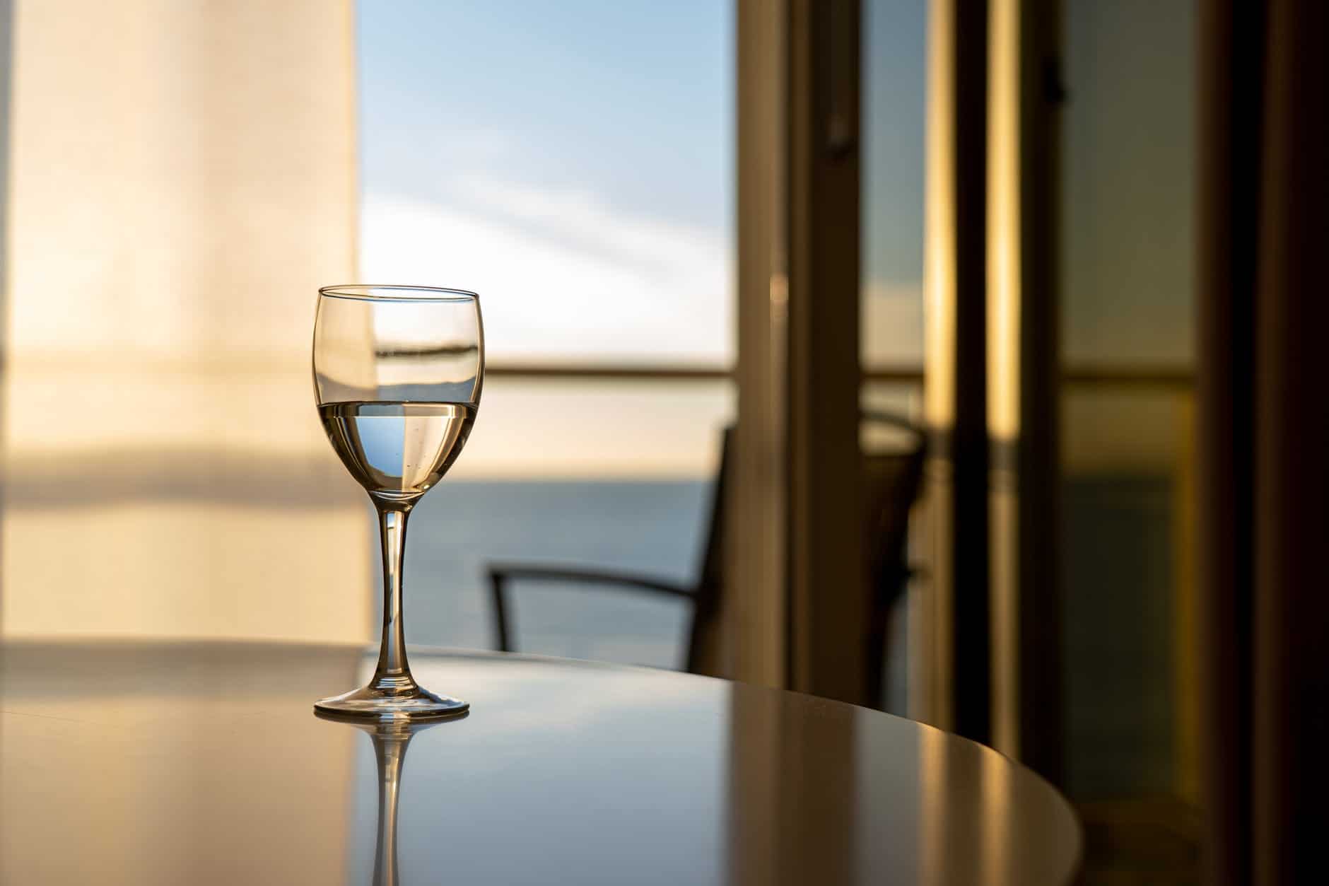 a wine glass on dining table