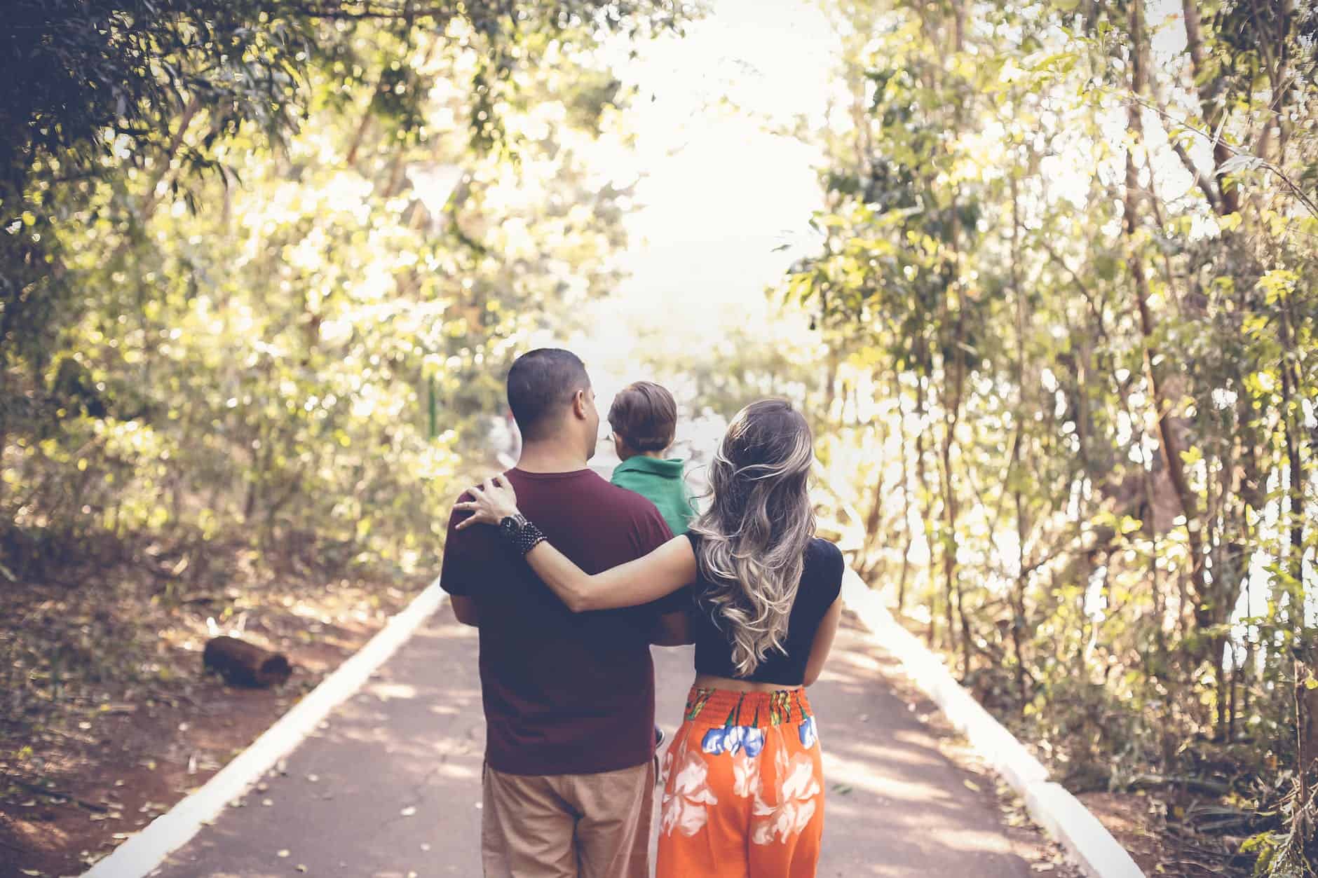 photo of family walking on park