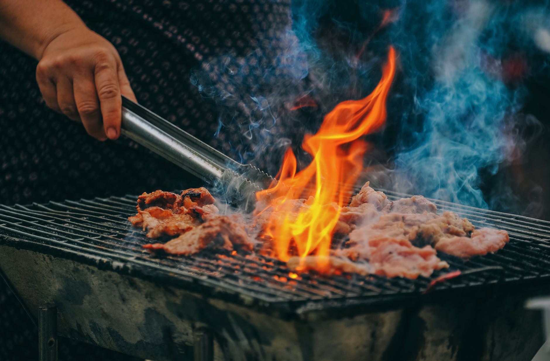 pexels-photo-1482803 close up photo of man cooking meat