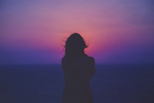 women with purple background