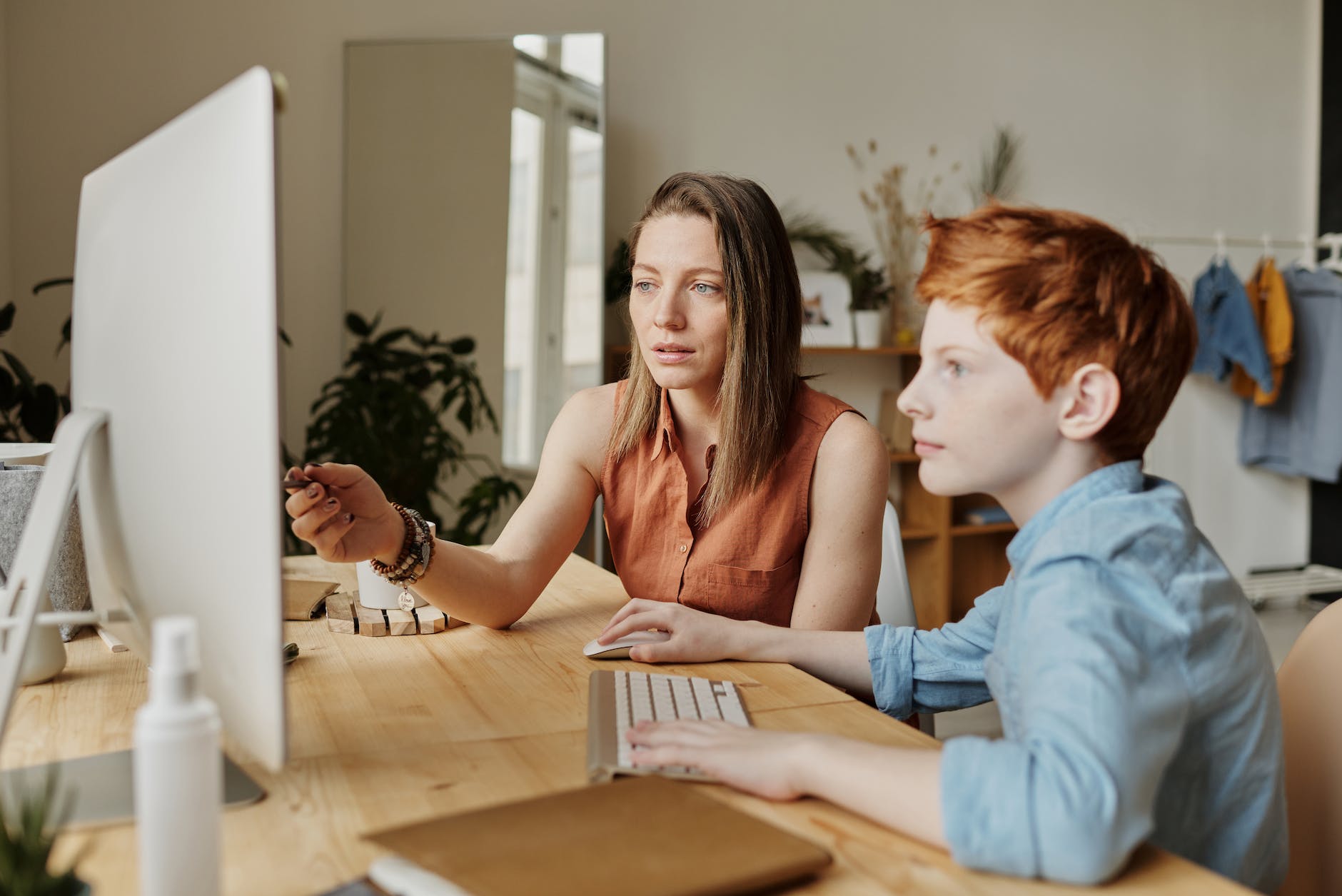 pexels-photo-4145354 photo of woman tutoring young boy