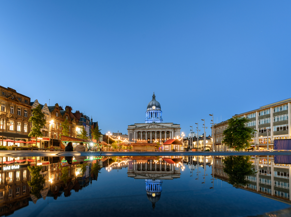 Nottingham market square with council house and new redevelopment pool with fountain in the square in Nottingham city, England.