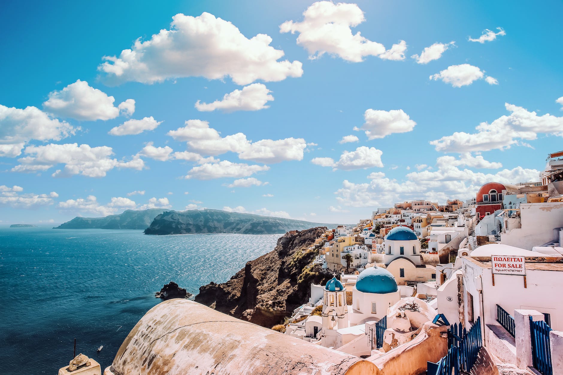 pexels-photo-1285625 white concrete house near body of water under white and blue cloudy sky