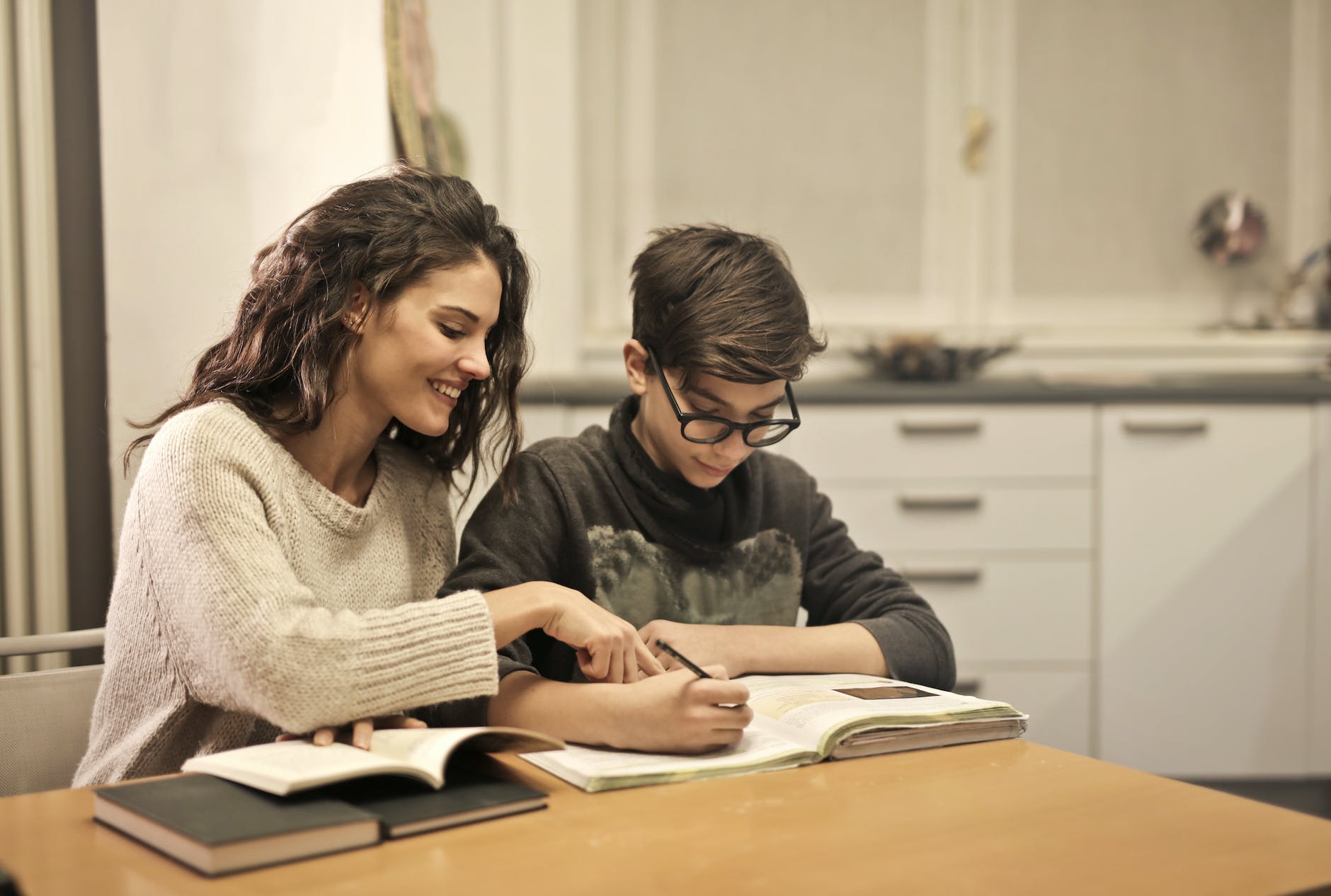 pexels-photo-3769981 elder sister and brother studying at home