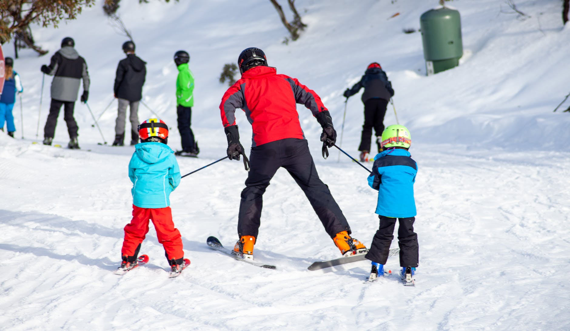 people skiing on snow covered ground