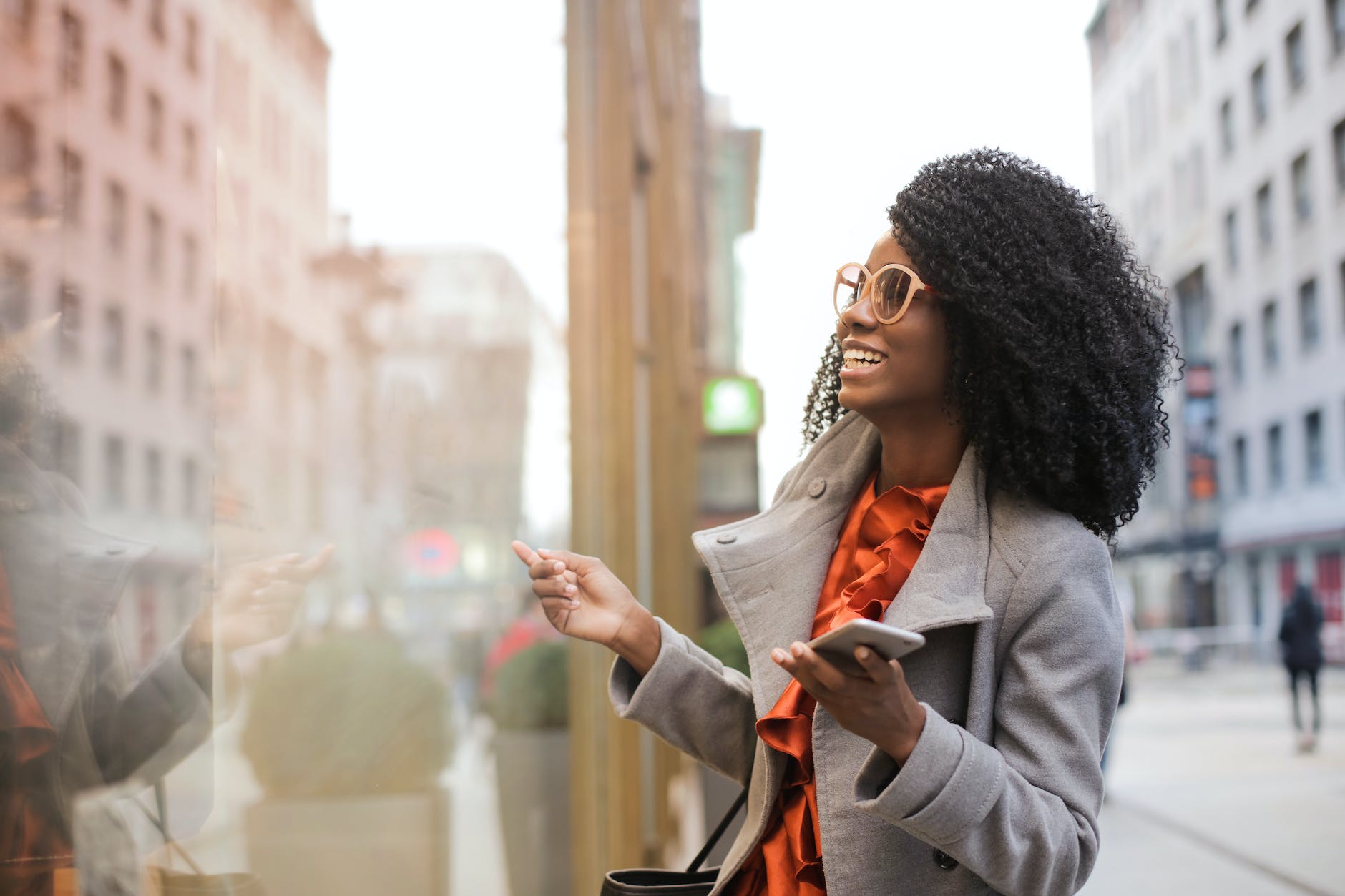 pexels-photo-3762927 happy black woman laughing on street