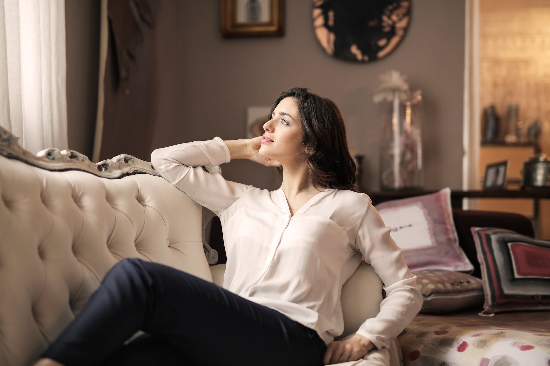 woman in white dress shirt and black pants