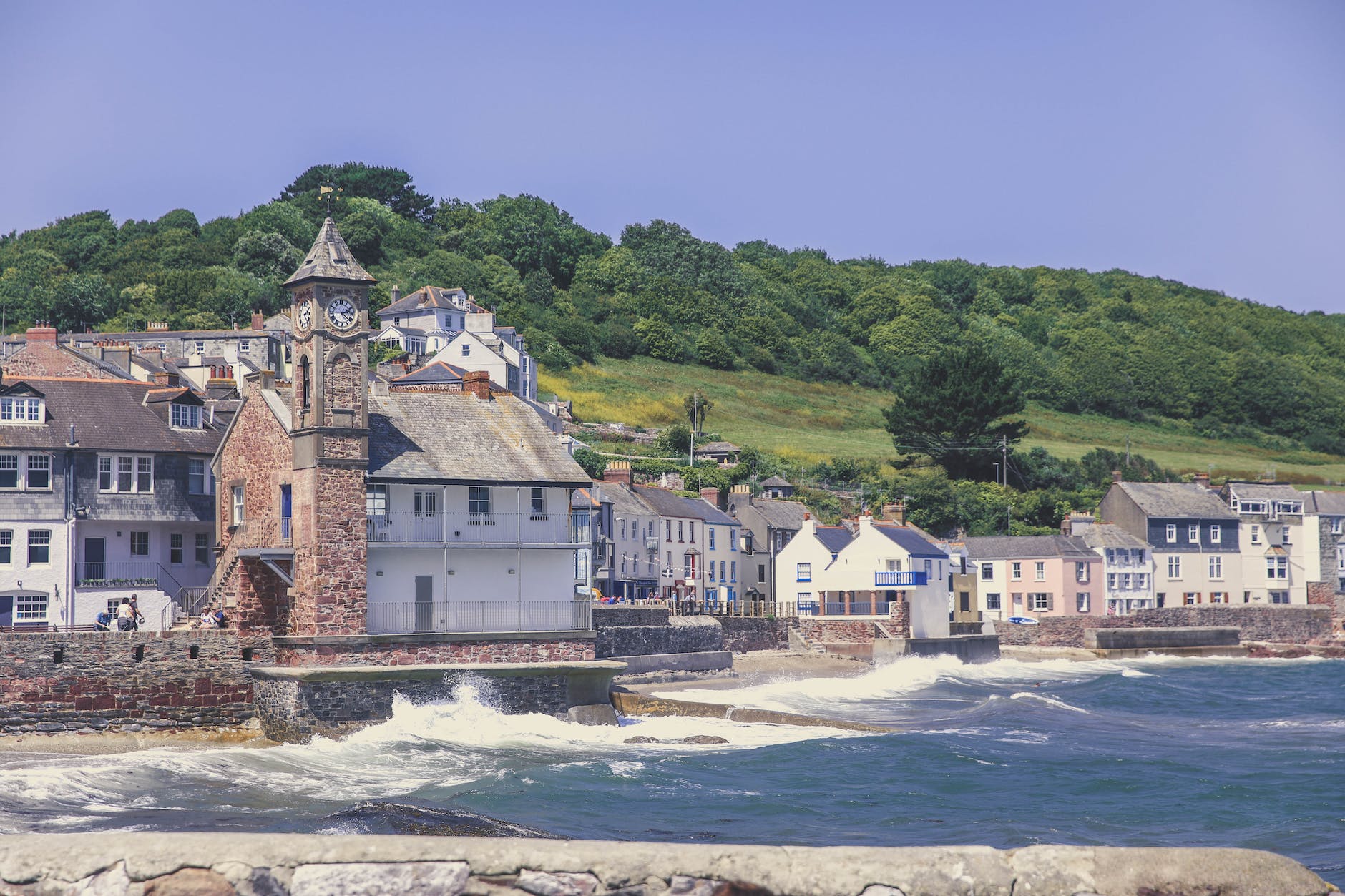 the clock tower on kingsand beach in cornwall coast