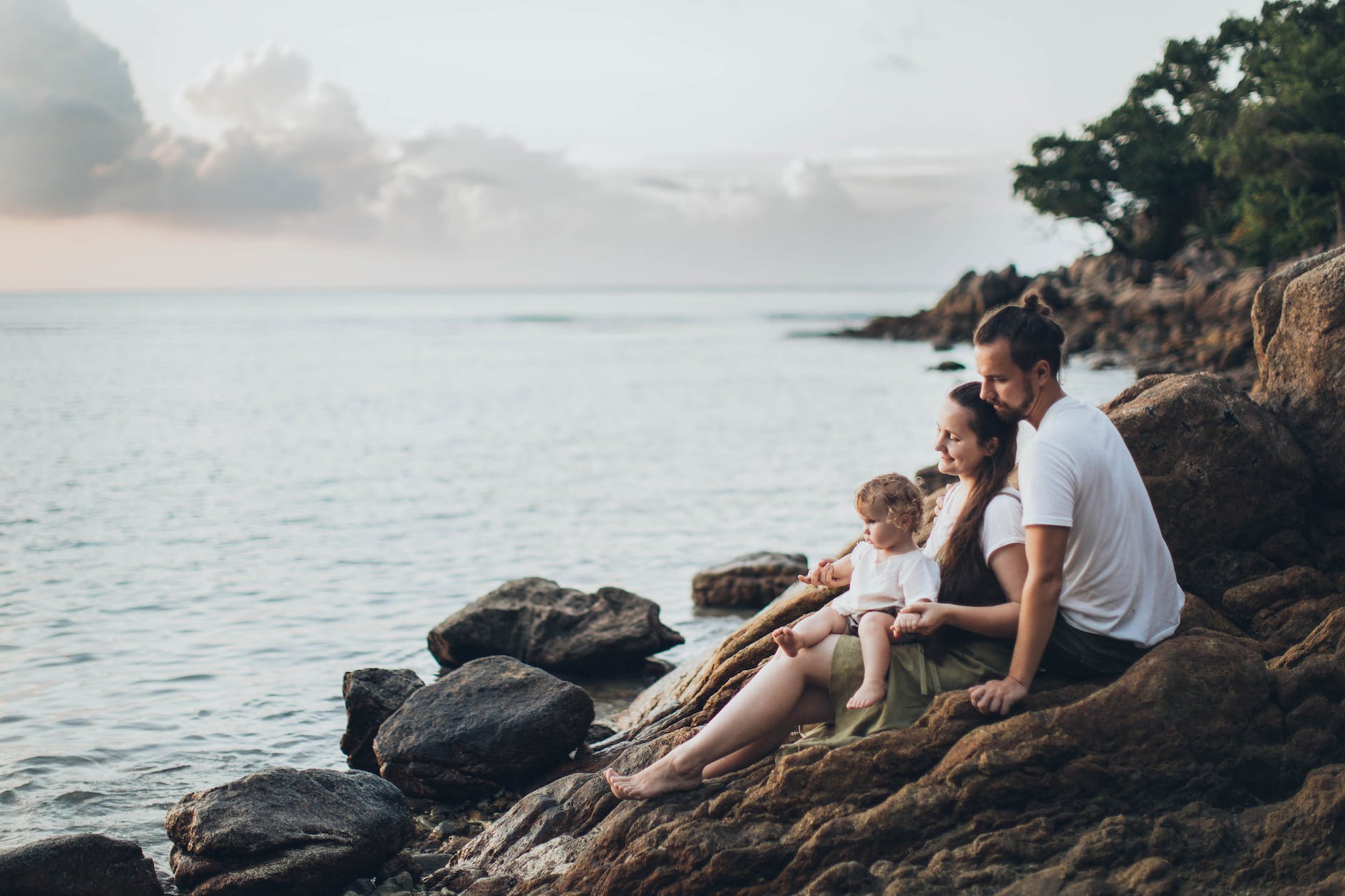 pexels-photo-1914982 man and woman sitting on rock near seashore