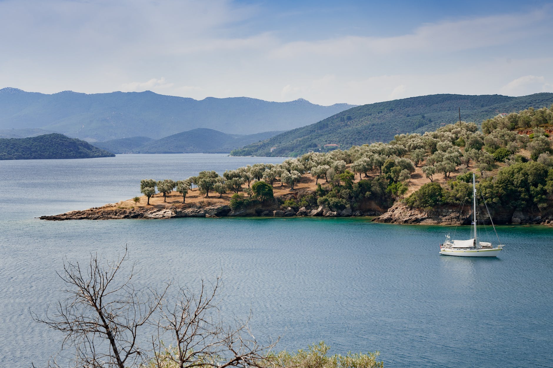 white yacht on body of water