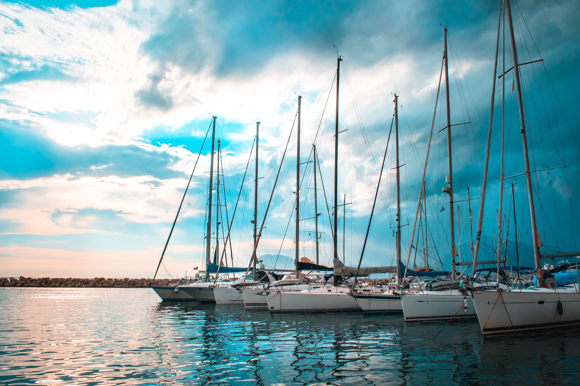 pexels-photo-445363 six white boats under horizons
