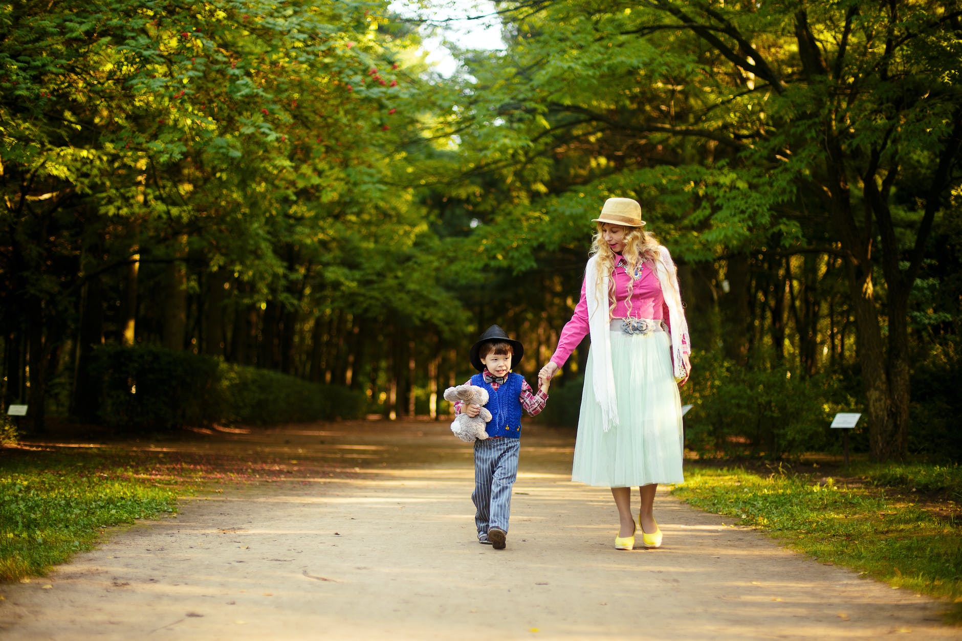 woman walking with boy