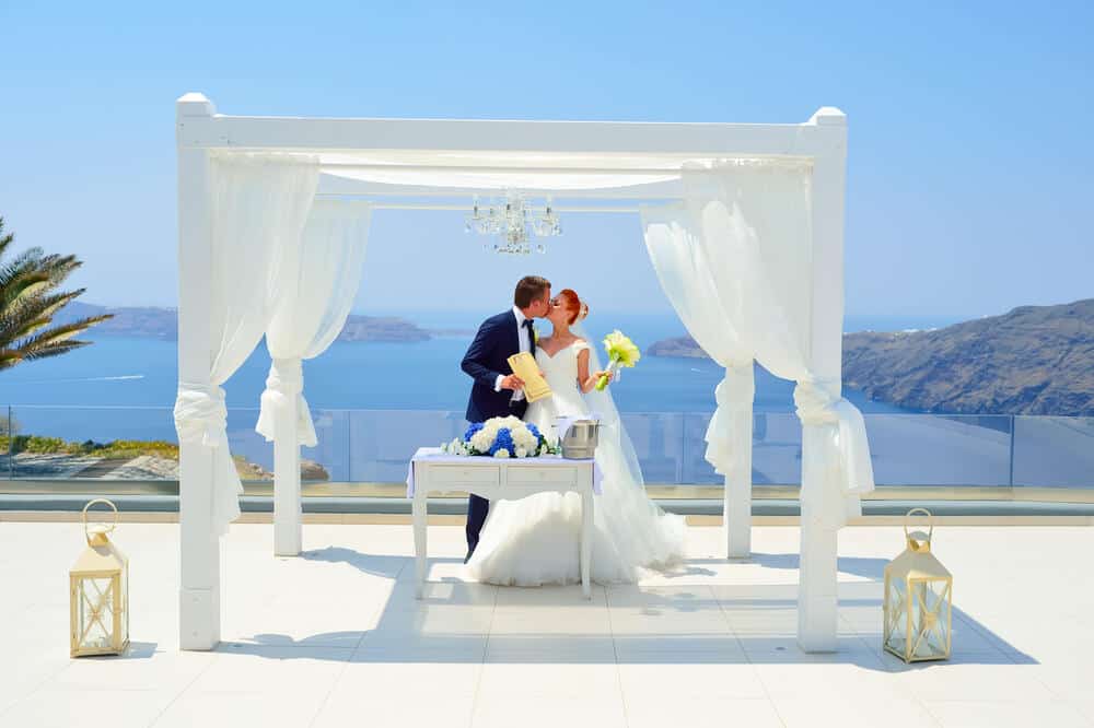 Beautiful young couple bride and groom celebrate wedding on Santorini