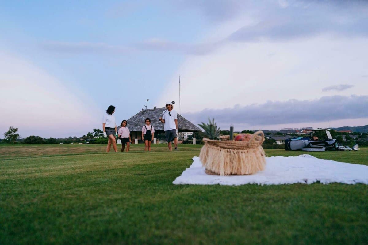 family playing golf