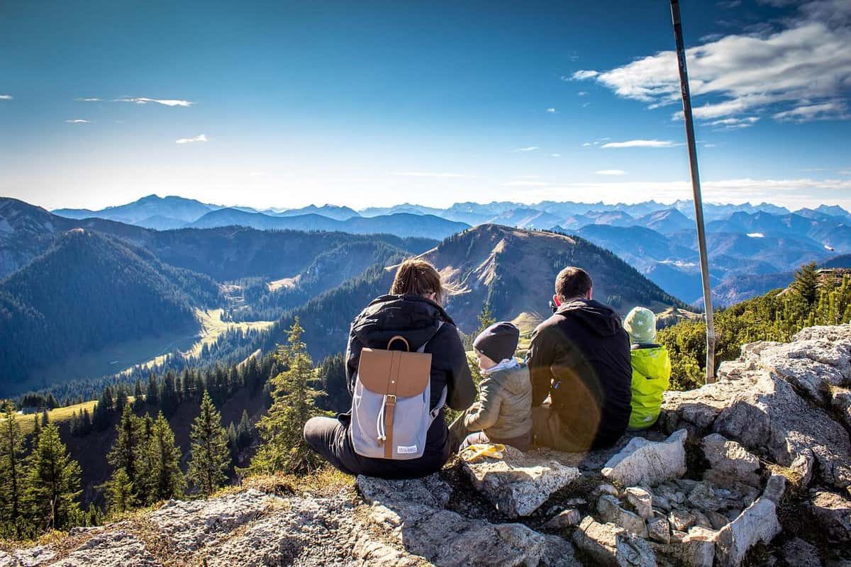 family resting on hike