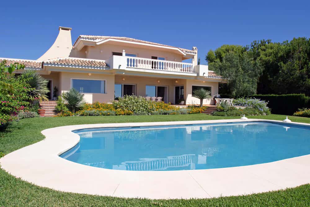 Luxury swimming pool and exterior of villa in Spain