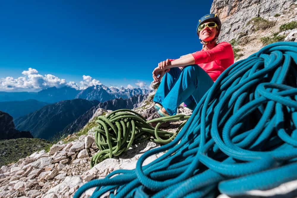 Young woman climber waiting to start the climb