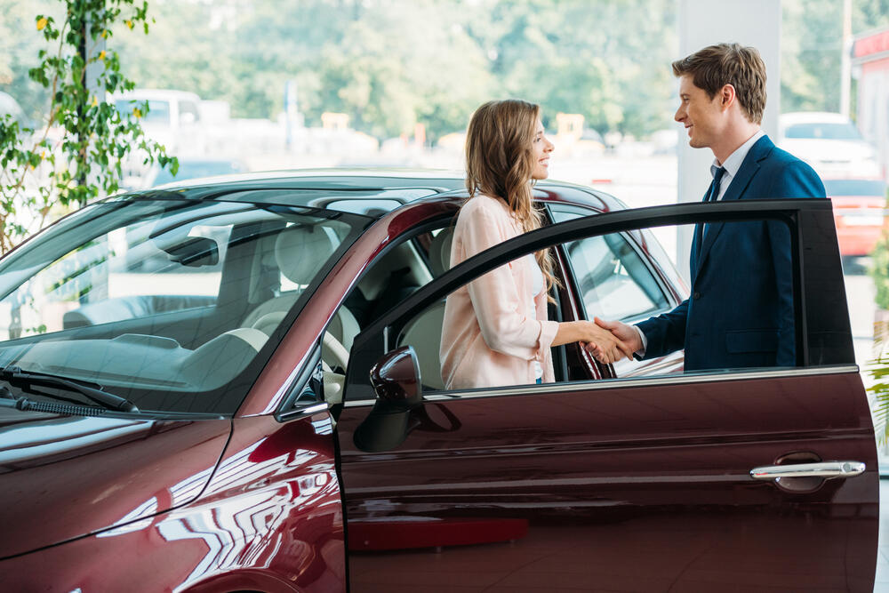woman buying used car